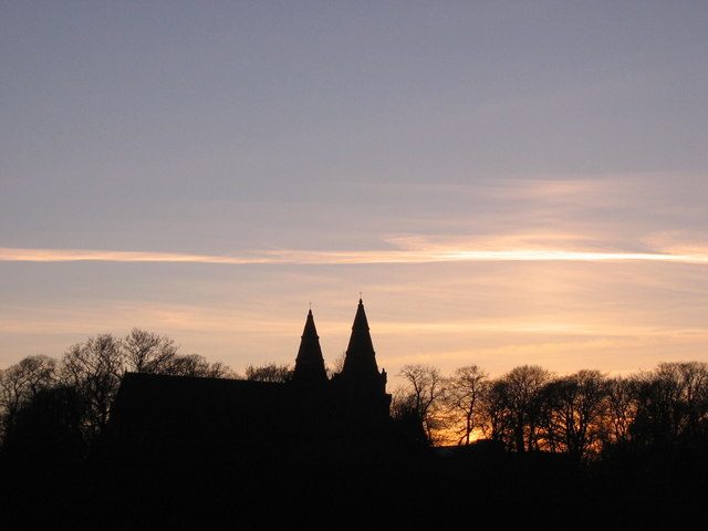 The twin spires of St Machar's Cathedral in silhouette at sunset, Old Aberdeen